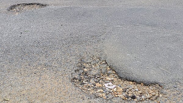 Two potholes in Westbury Road