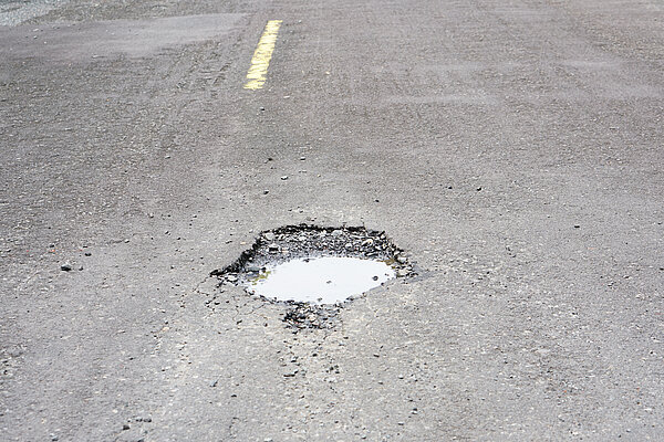 Pothole filled with water