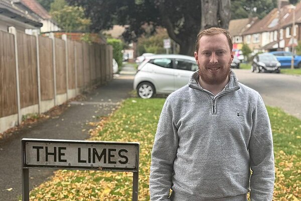 Brenner Munden in front of The Limes sign