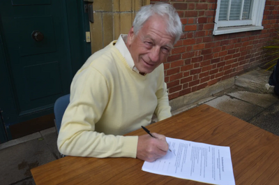 Image courtesy of Cllr Karen Chilvers Cllr Barry Aspinell (re-elected to Pilgrims Hatch on Thursday and as Lib Dem Leader tonight) signs the Brentwood Accord