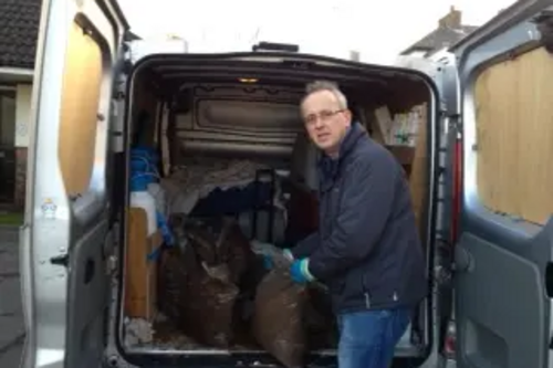 Cllr David Kendall delivering salt bags